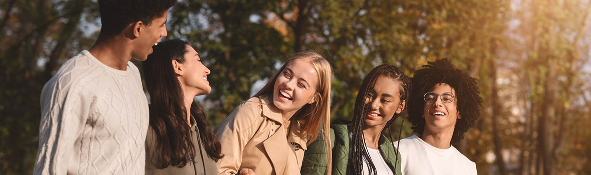 Group of students walking on campus grounds